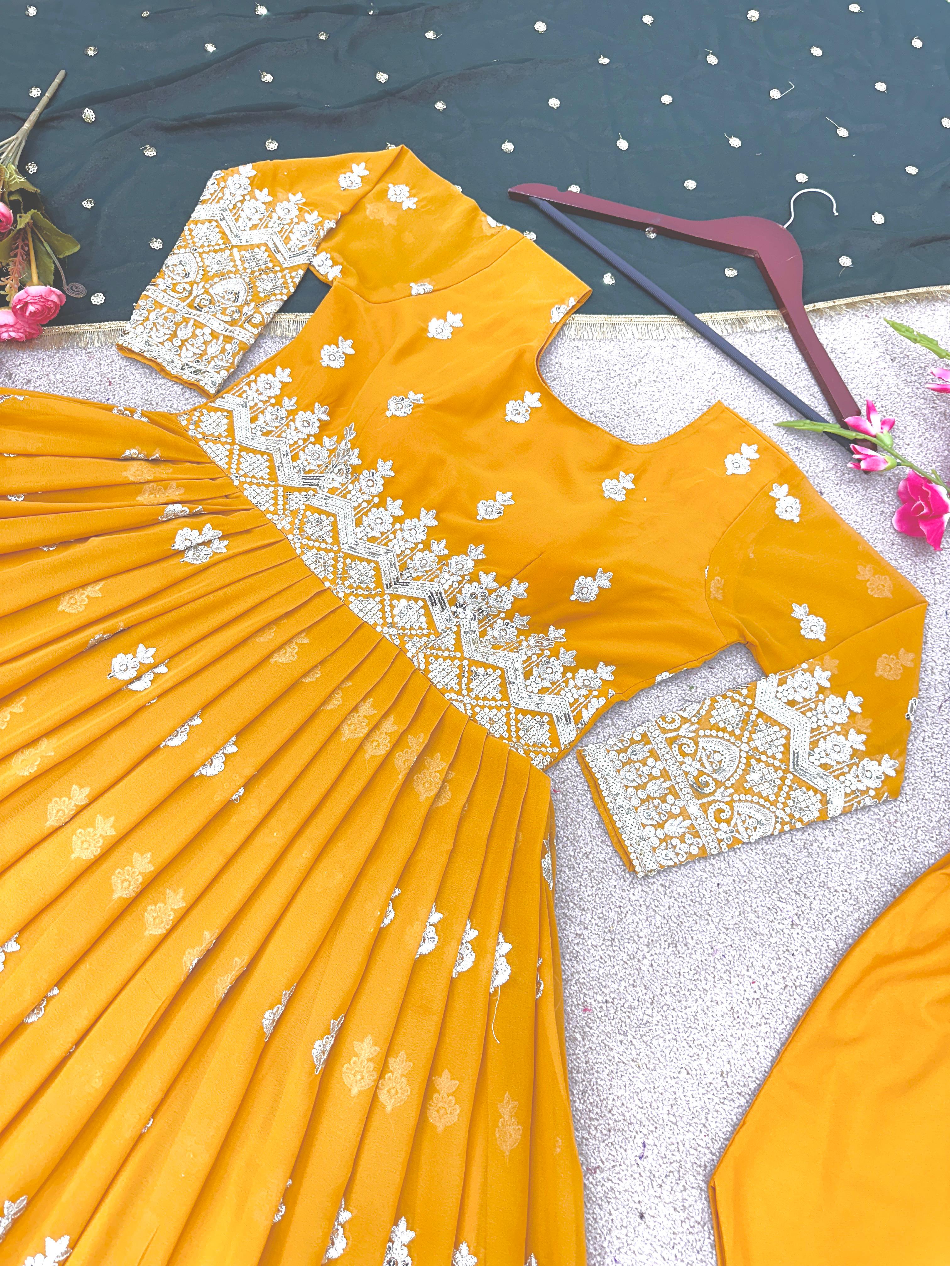 Opulent Yellow Sequence Work Gown With Green Dupatta