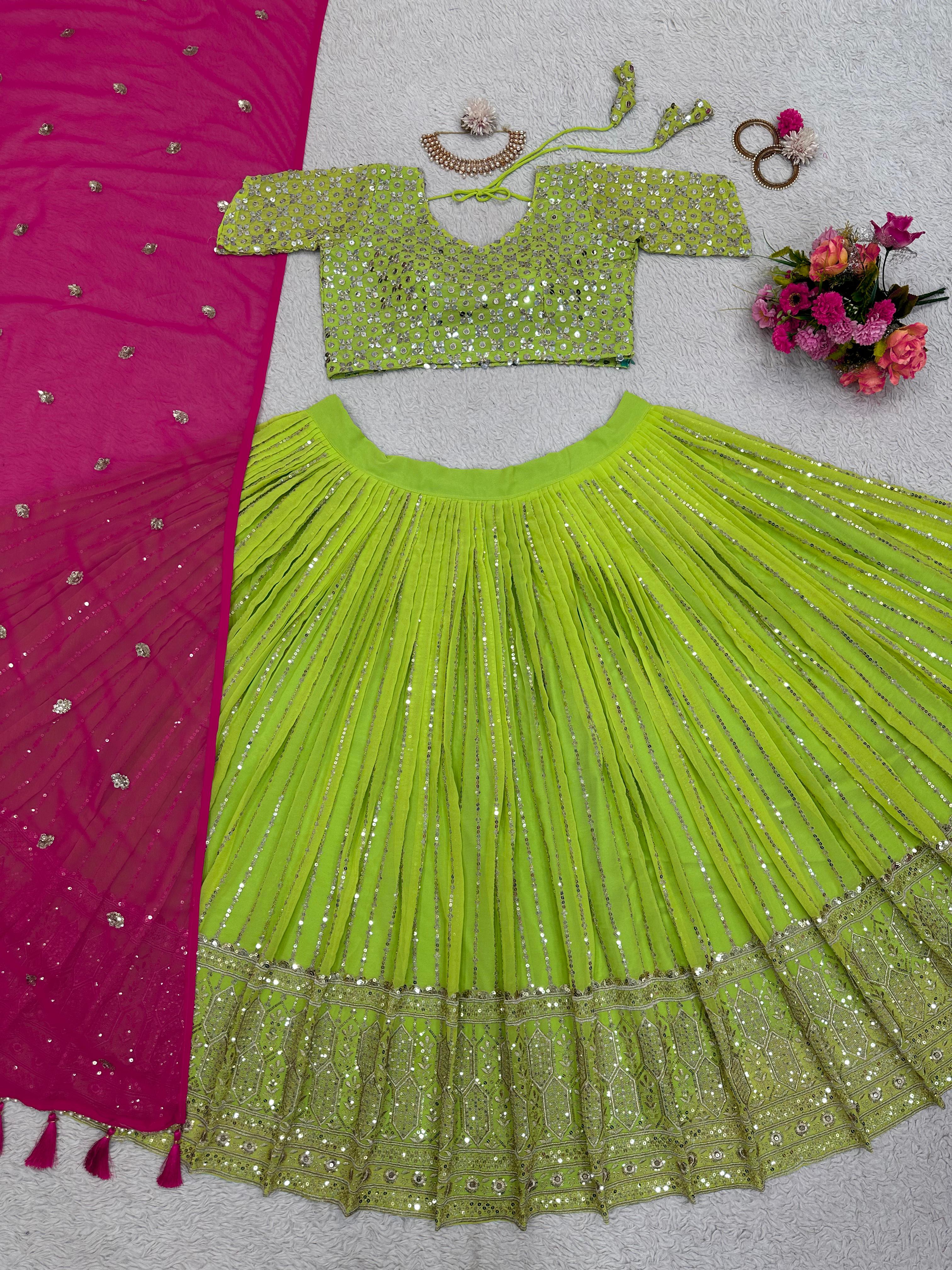 Traditional Wear Parrot Green Lehenga Choli With Pink Dupatta