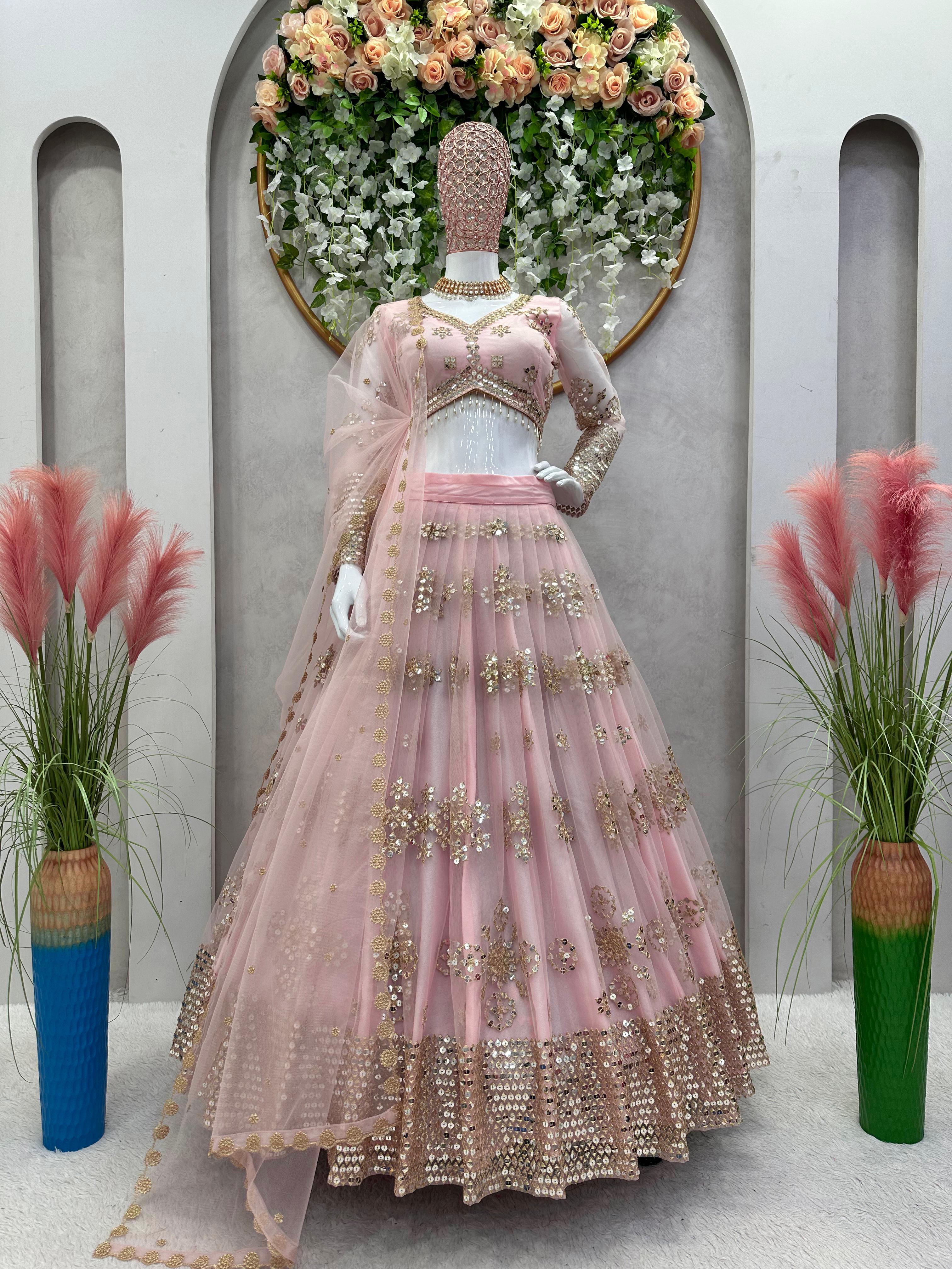 Ravishing Sequence Work Light Pink Net Lehenga Choli