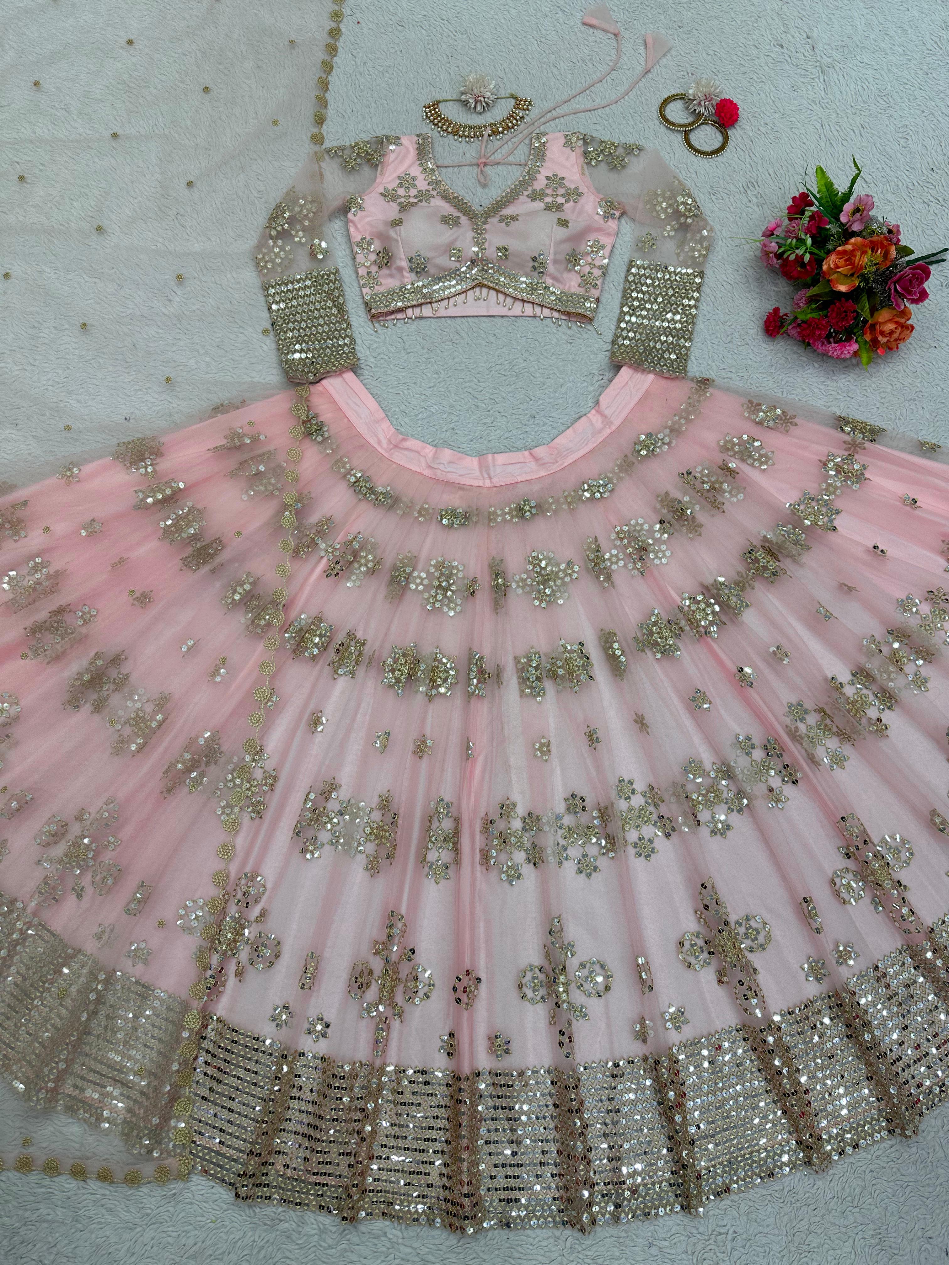 Ravishing Sequence Work Light Pink Net Lehenga Choli