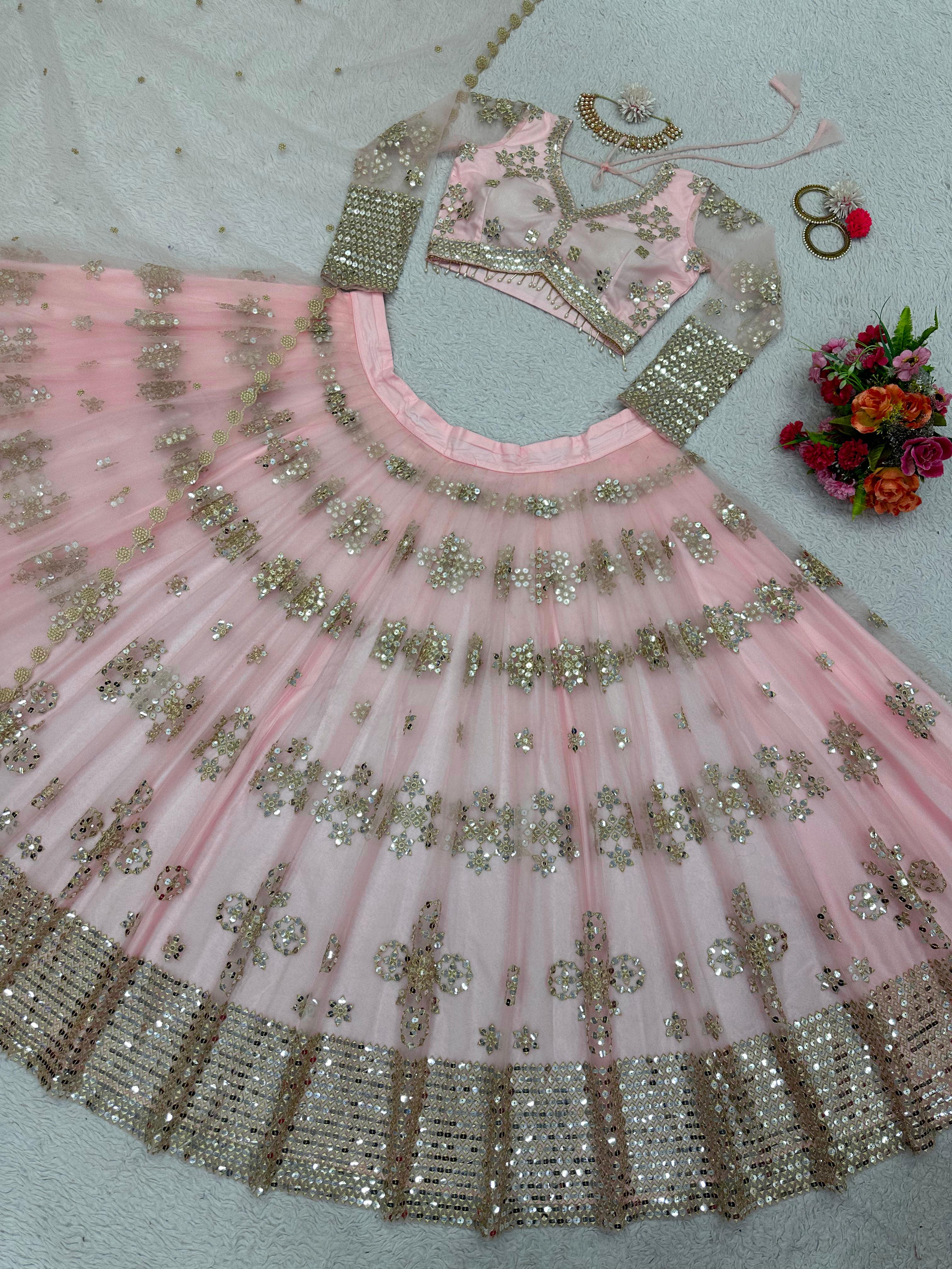 Ravishing Sequence Work Light Pink Net Lehenga Choli