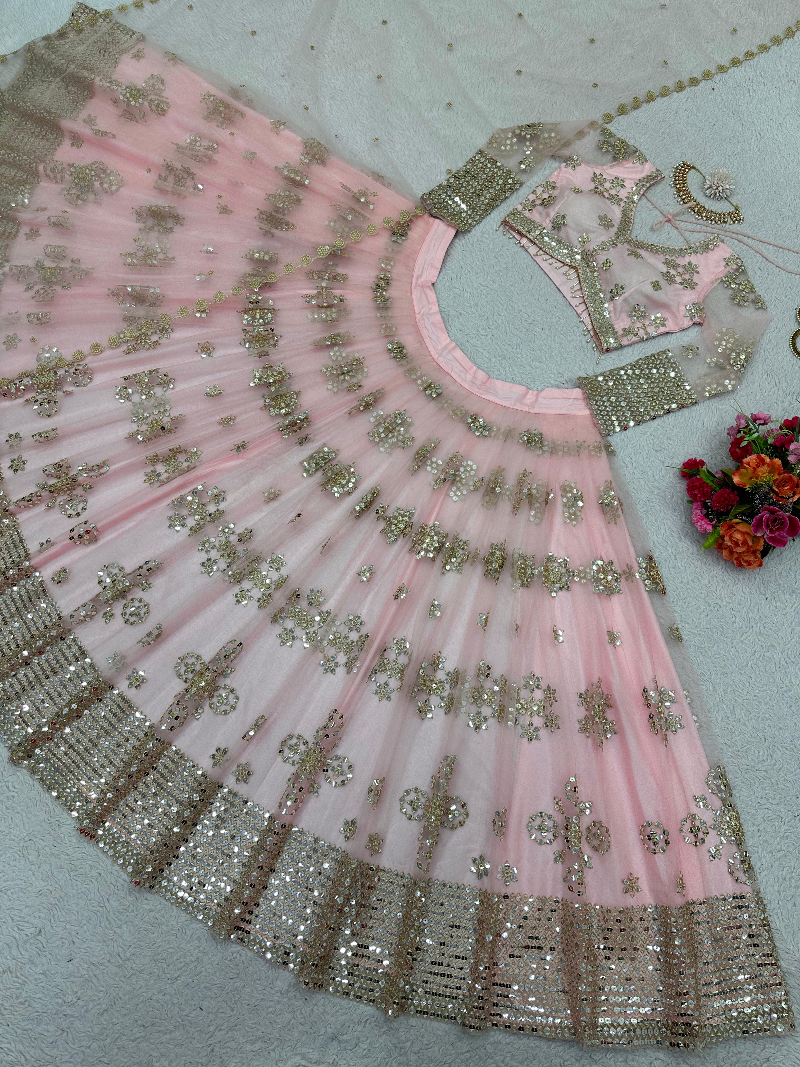 Ravishing Sequence Work Light Pink Net Lehenga Choli