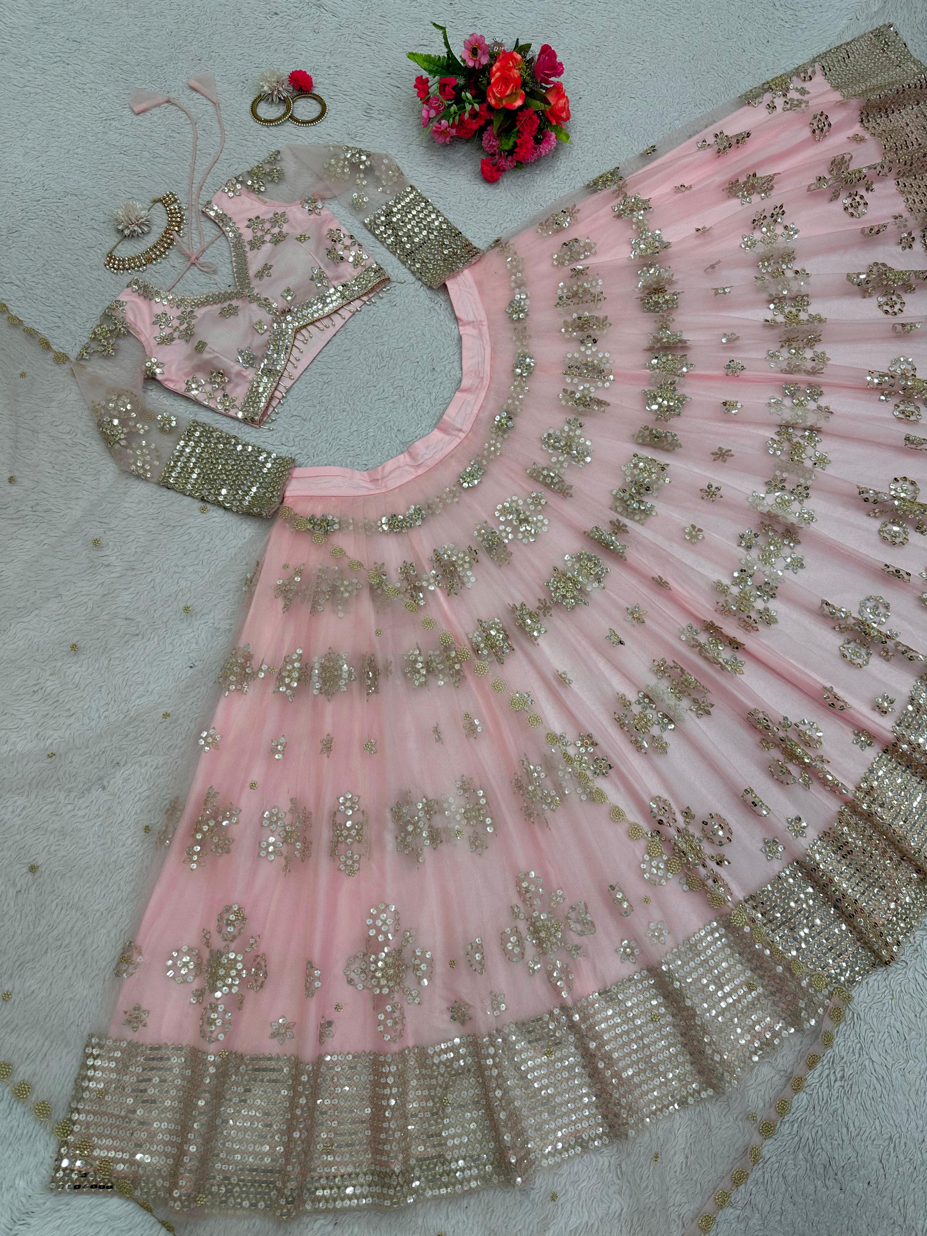 Ravishing Sequence Work Light Pink Net Lehenga Choli