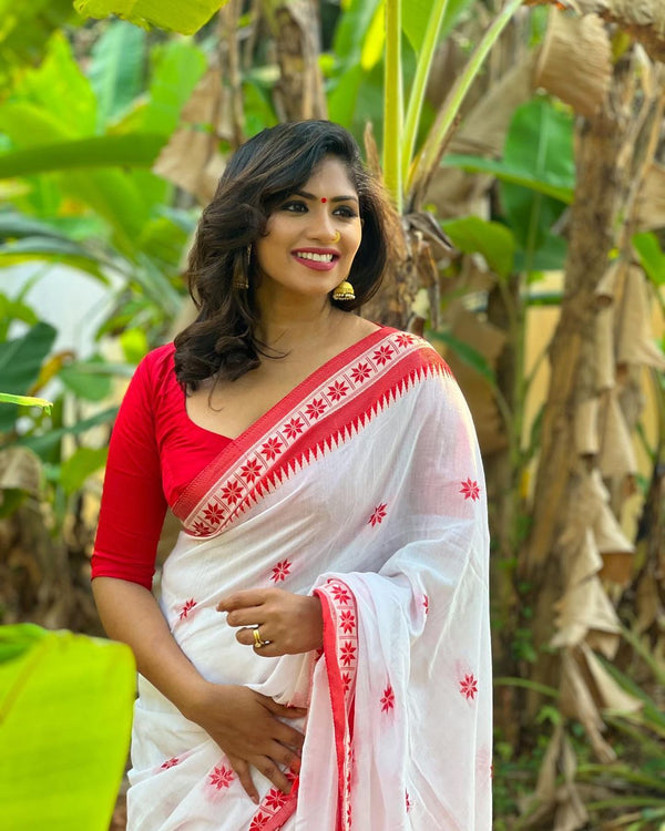 Admiring White And Red Color Saree